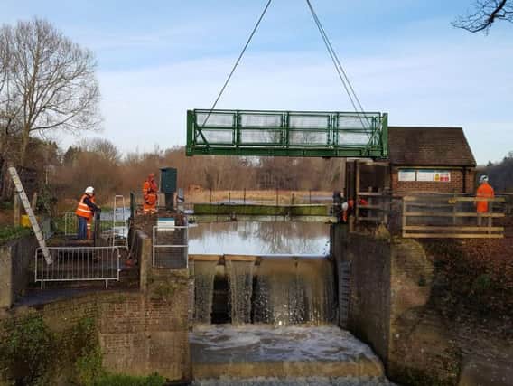 Richard Symonds submitted this photo of a new footbridge being winched into place across the millpond sluice, between the Warnham Nature Reserve Visitors Centre and the Warnham Mill.