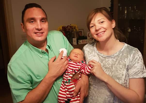 Kevin Flynn, 37, and Sabrina Simonini, 29, with their daughter Skyla Rae Flynn, who was born on Christmas Day.