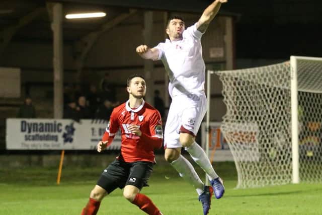 Sam Cole goes up for a header during his 20-minute run-out as a substitute. Picture courtesy Scott White