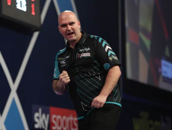 Rob Cross celebrates an important dart against John Henderson. Picture courtesy Lawrence Lustig/PDC