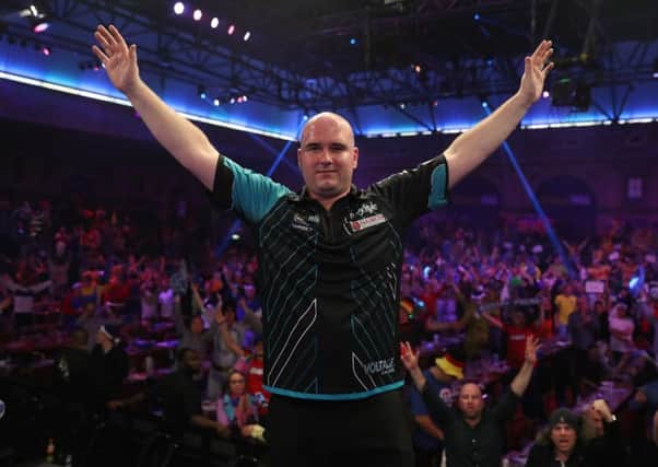 Rob Cross celebrates after his magnificent victory over Michael van Gerwen at Alexandra Palace, London, last night. Picture courtesy Lawrence Lustig/PDC