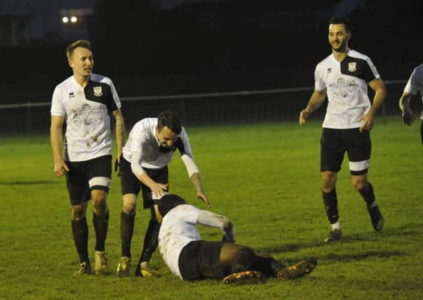 Bexhill United celebrate after Georges Gouet breaks the deadlock against Seaford Town. Pictures by Simon Newstead