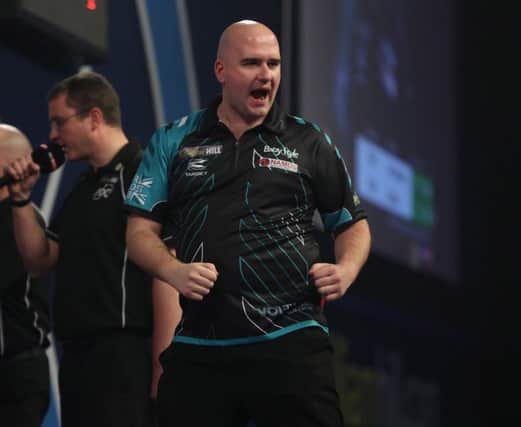 Rob Cross celebrates after landing a key dart during his semi-final victory over Michael van Gerwen. Picture courtesy Lawrence Lustig/PDC