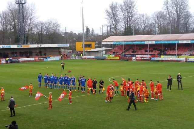 Crawley Town and Stevenage teams take to the field.
Picture by Sam Morton