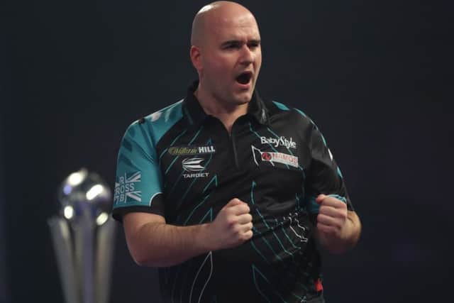 Rob Cross celebrates after hitting an important dart in the final. Picture courtesy Lawrence Lustig/PDC