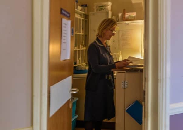 Caroline Sercombe, deputy nurse manager, in the cupboard where staff currently prepare medicines