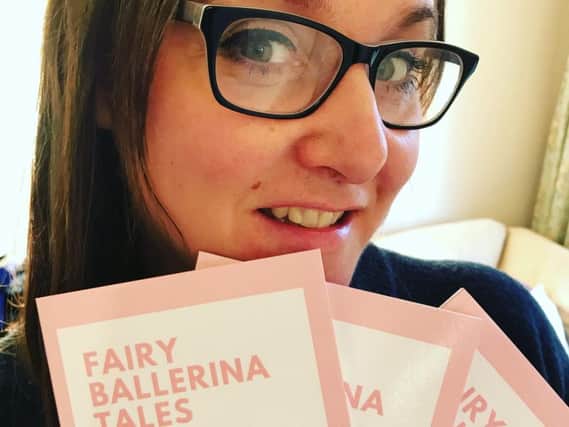 Hilary Thomas with her self-published book, Fairy Ballerina Tales, which is raising money for her ballet school's summer show.