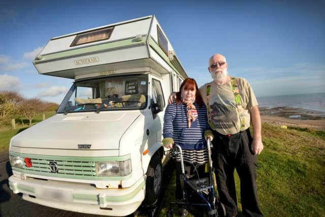 Graham and Sarah Preston outside their motorhome, Galley Hill, Bexhill. SUS-181001-142849001