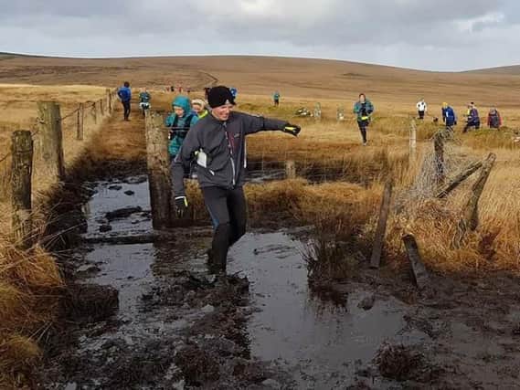 Lee Crow tackles the puddles on the Brown Willy Run (courtesy: Bridget Funnell)