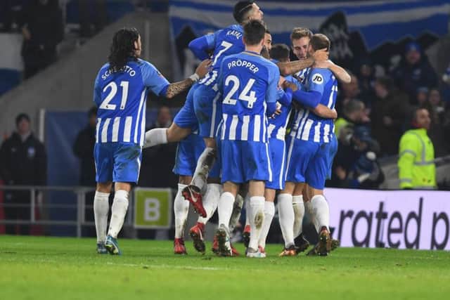 Glenn Murray is mobbed by his Brighton & Hove Albion team-mates after netting a late winner against Crystal Palace in the FA Cup. Picture by PW Sporting Pics