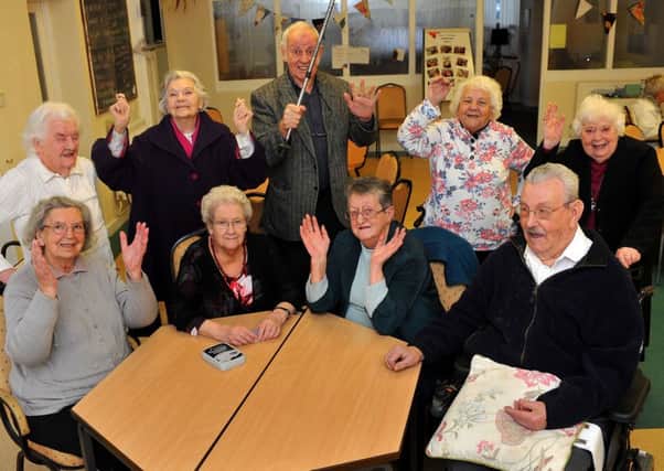 Age UK members celebrating the good news. Picture: Steve Robards