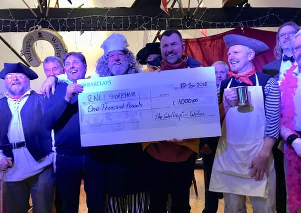 The Wellington Wailers present ?1,000 to Shoreham lifeboatmen as part of their ongoing fundraising through CD sales SUS-180115-142733001