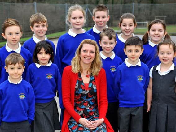Headteacher Wendy Millbanks and some of the Balcombe Primary School children