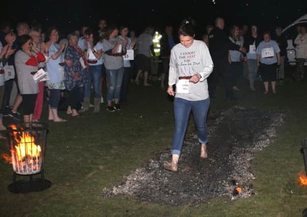Treading hot coals for charity SUS-180901-101506001