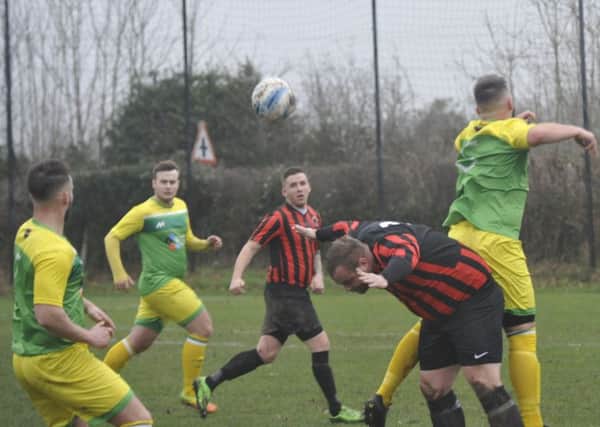 Action from Westfield's 8-0 victory at home to Rottingdean Village on December 30. Pictures by Simon Newstead