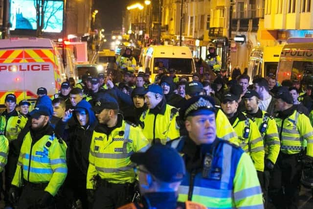 Police were out in force around Brighton station as football fans made their way to the Amex stadium (Photograph: Eddie Mitchell)