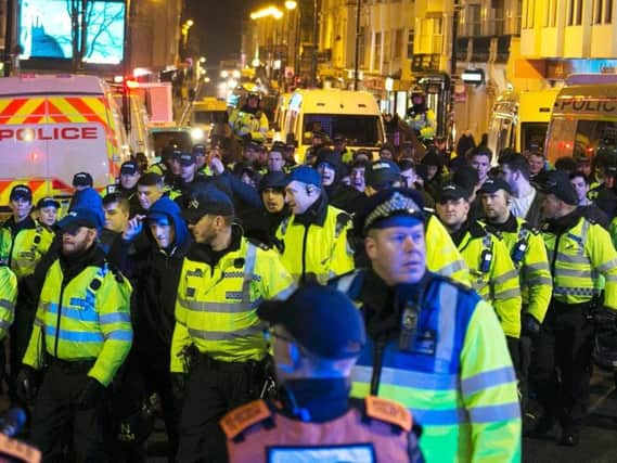 Police were out in force around Brighton station as football fans made their way to the Amex stadium (Photograph: Eddie Mitchell)