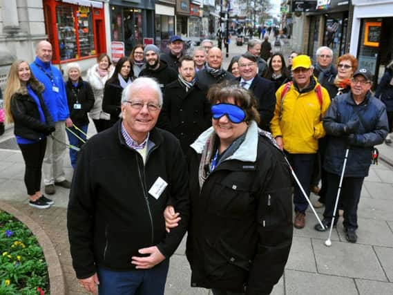 Barry Ward, chairman of Sight Support Worthing, guides Diane Guest, executive member for environment on Worthing Borough Council. Picture: Steve Robards SR1801674