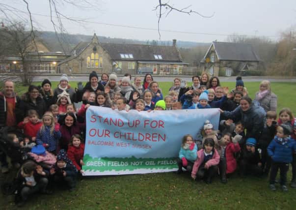 Parents and children in Balcombe protesting against the plan