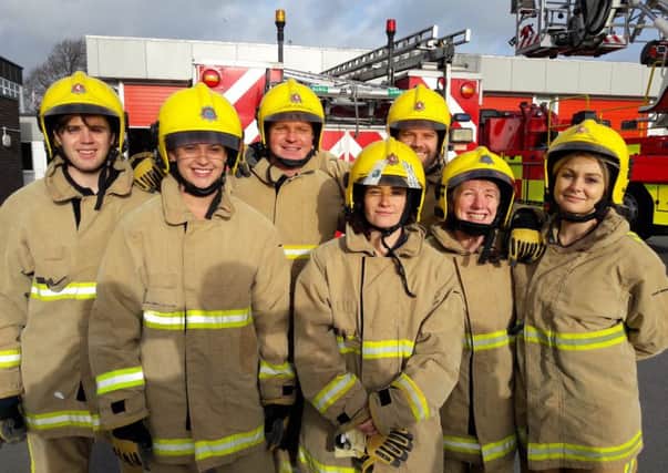 Exercise therapists, physiotherapists and psychological therapists from Marine Court in Littlehampton experienced life as a firefighter. Pictures: Worthing Fire Station