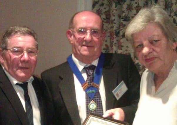Mo and Frank receive their award in 2012 from the then Midhurst Town Council chairman John Etherington