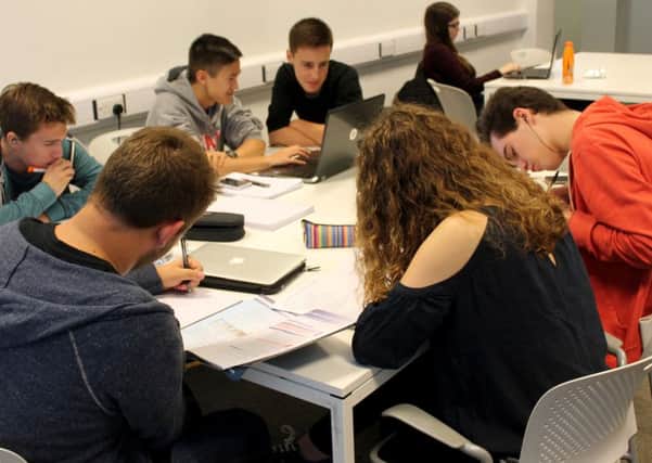 Worthing College students studying