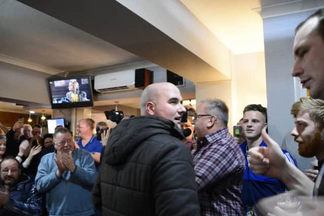 Rob Cross celebrates his 2018 World Darts Championship victory at Sidley Working Men's Club. Picture courtesy Liz Kelly