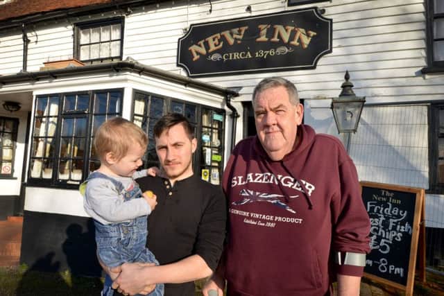 Stephen Lucas (right) with Dominic Izzard (left) and Fletcher Izzard outside the New Inn in Sidley. SUS-180116-111358001
