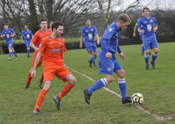 Action from Battle Baptists' 2-0 win away to Sidley United last weekend which took them top of the table. Picture by Simon Newstead