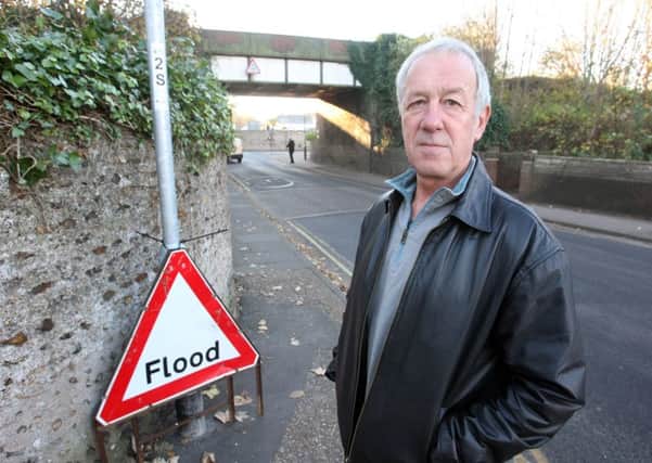 Will Flewett at the junction of Southdown Road and Western Road where the road floods regularly