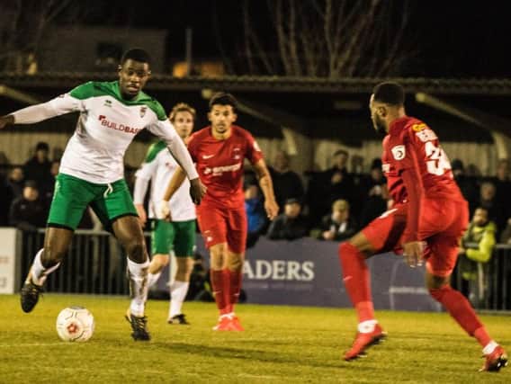 Bognor defender Manny Adebowale gets stuck in against Orient / Picture by Tommy McMillan