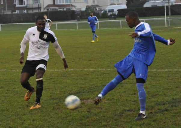 Bexhill United wing-back Georges Gouet closes down the Oakwood player in possession. Pictures by Simon Newstead