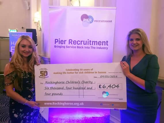 Emma Jones and Katie Gibson from Pier Recruitment with the cheque for Rockinghorse