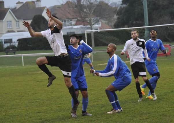 Jack McLean goes up for a header during Bexhill United's 2-1 win at home to Oakwood on Saturday.