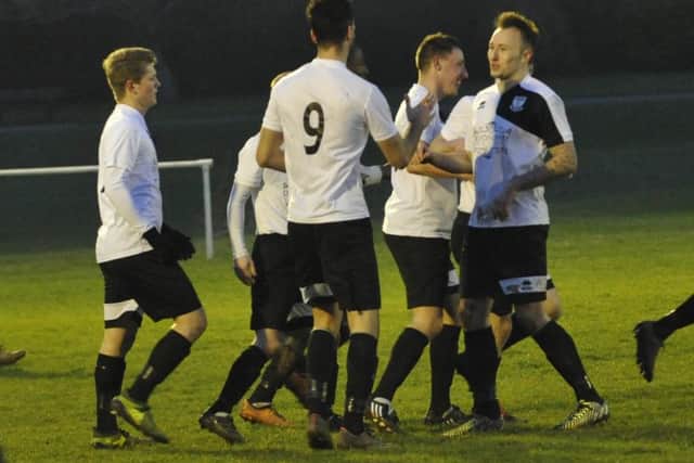 Bexhill celebrate their opening goal, scored by Connor Robertson.