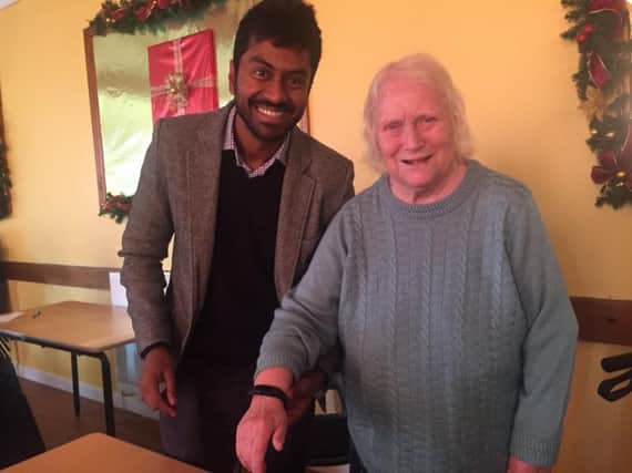 Dr Anand Sundaralingam and Leach Court resident Jean Murray with blood pressure monitor