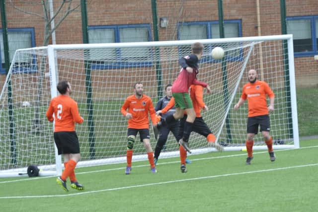 A Burwash header strikes the crossbar during the first half of their 6-0 defeat away to Orington.
