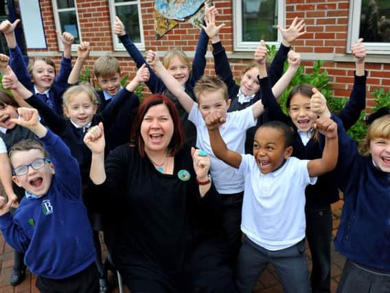 Headteacher Fi Dowley and some of the children from The Brook School