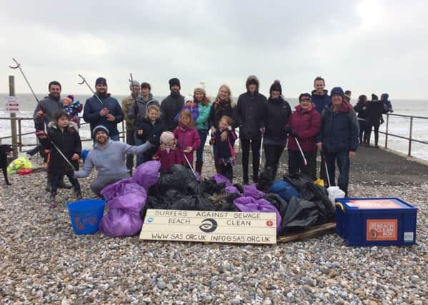 Volunteers with the 60 bags of rubbish they collected