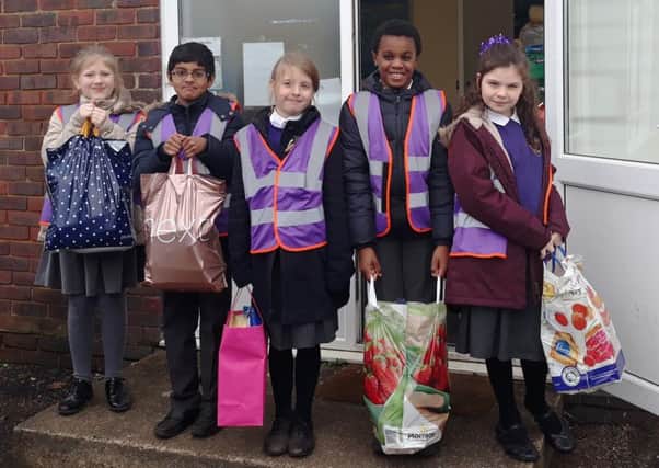 Pupils from St Marys Catholic Primary School deliver the gifts to Worthing Churches Homeless Projects