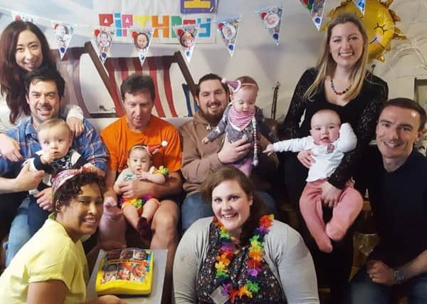 Tom and Louise Moss-Silverson with Una, second right, with other families at Ronald McDonald House for the first birthday party. Picture: Ronald McDonald House Charities