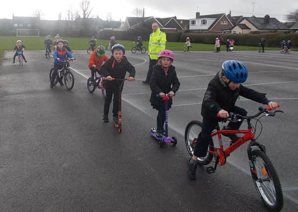 Pedalling around the one-way street set up at Upper Beeding Primary School
