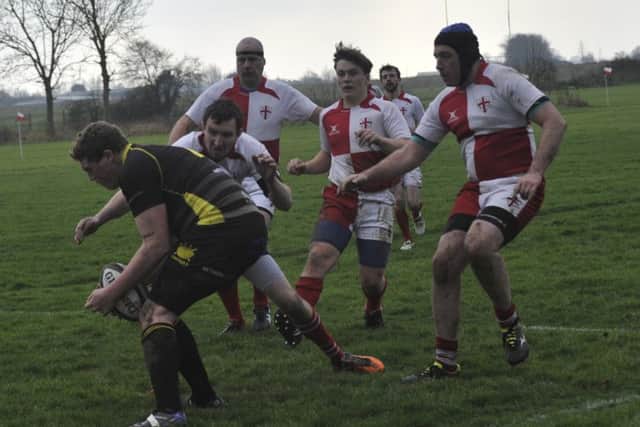 Rye line up a tackle on the St Jacques player in possession.