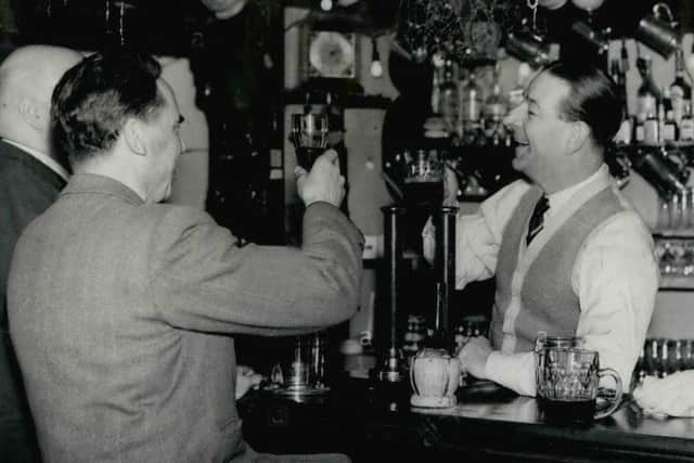 Actor Ronald Shiner behind the bar of the Blackboys Inn circa 1954. At the time he was one of Britains best-known actors whod enjoyed a prolific career on stage, screen and radio.