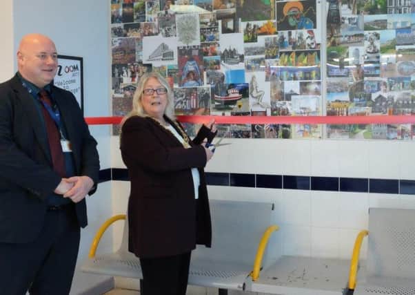 Hastings Mayor Cllr Judy Rodgers and station manager Simon Newbury unveil the new mural at Hastings train station SUS-180123-110243001