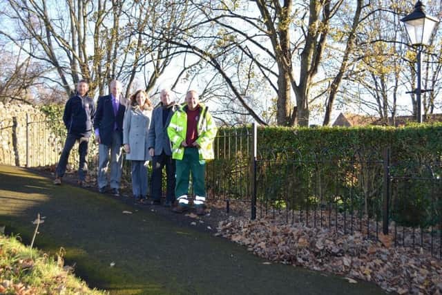 Next to the new railings, from left: Justin Jones, CDC Green Spaces team; Councillor Tony Dignum, CDC Leader; Stephanie Jones, Natures Way Foods; Councillor Richard Plowman, Friends Chairman; and Steve Smart, CDC Green Spaces team.