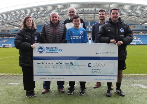 The cheque of ?2,000 for Albion in the Community being donated by North West Sussex Seagulls SUS-180123-134458001