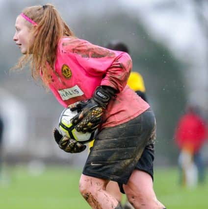 Graves Mile Oak Cup: Crawley Wasps' Under-16s goalkeeper Lauren Graves emerges from a muddy goalmouth (Picture: Dave Burt - www.daveburtphotography.co.uk). SUS-180122-213742002