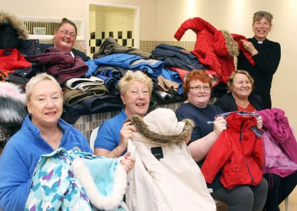Volunteers with the coats donated when the Coats for Kids scheme was launched in Shoreham. Picture: Derek Martin DM17101631a
