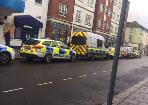 Police and immigration enforcement vehicles down Rowlands Road in Worthing. Picture: Cody Saunders-Doyle